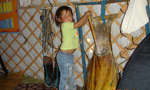 Toddler learning chunk airag in leather sack