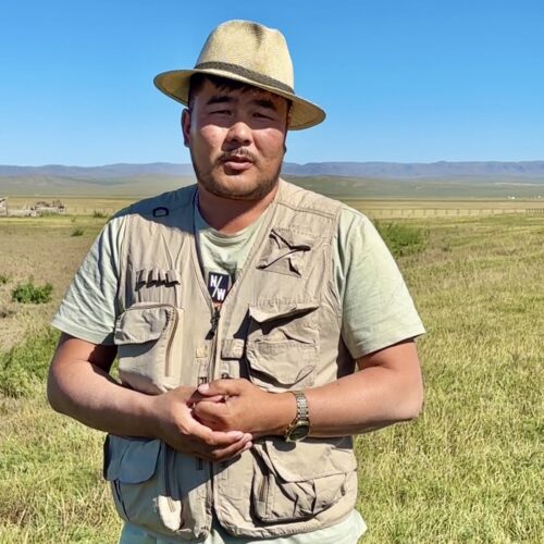 Our expert, archeologist Dr.Iderkhangai standing in front of Luut city remains, which he discovered in 2020.