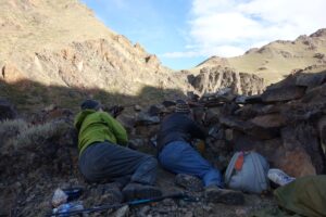 Travelers in hide-outs spotting rare wildlife without disturbing it. Tost Mountains, Western Gobi Desert, Mongolia. 