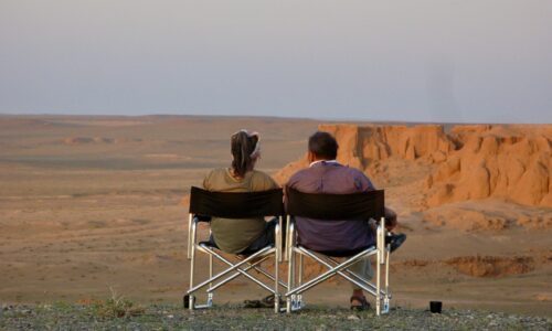 Our customers having a great time during sunset at Oviraptor VIP camp, Flaming Cliffs, 2023.