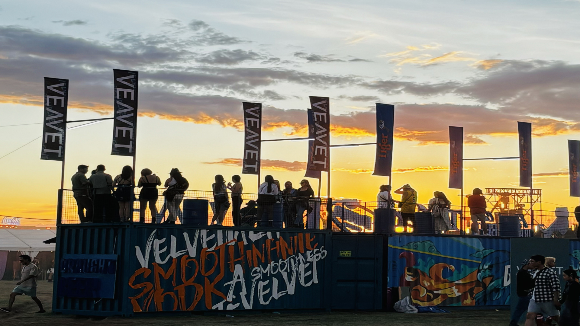 People standing on container-made party ground during sunset, at Playtime Festival 2024