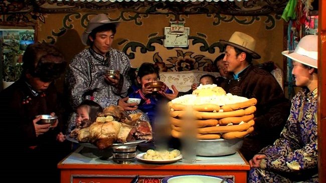 Mongolian family celebrating tsagaan, the Mongolian lunar new year.