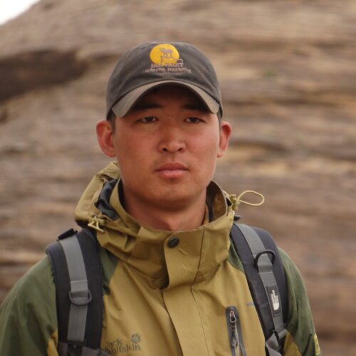 Khuderchuluun Gantumur, Mongolian wildlife biologist and one of our expert tour leader, pictured in a professional outdoor portrait.